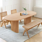 Oval dining table made of solid ash wood with a smooth finish, perfect for modern dining rooms